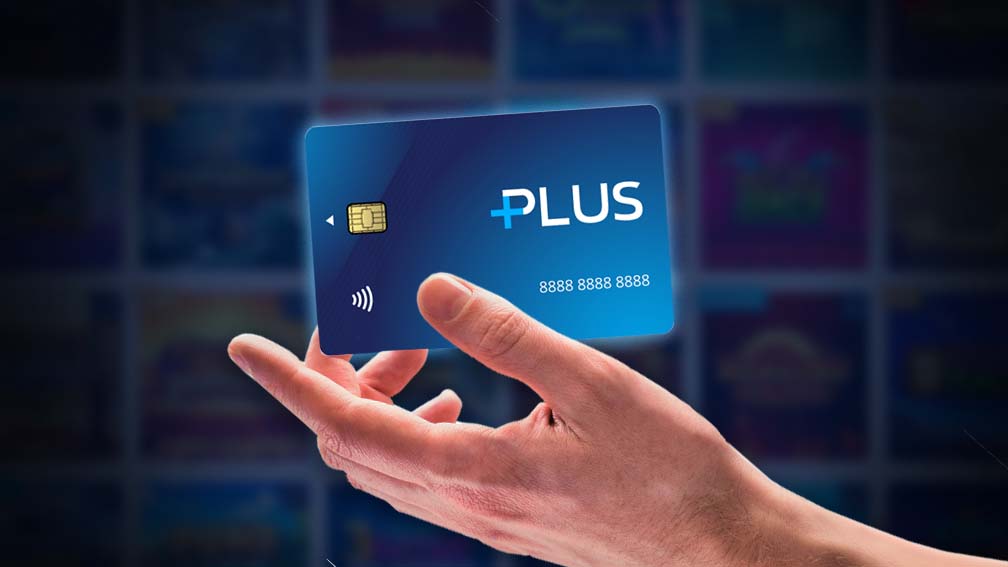 Hand holding a William Hill Plus card